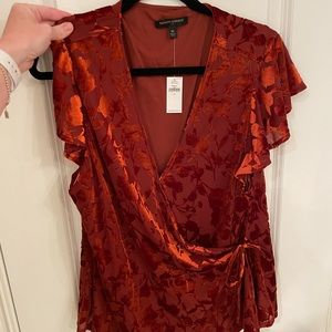 Gorgeous wrap top with vibrant shade and beautiful detailing.